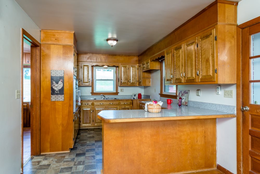 719 Middlebrook Road Staunton, VA 24401 - Photo 4 of 26 a view of a kitchen with fridge and wooden floor