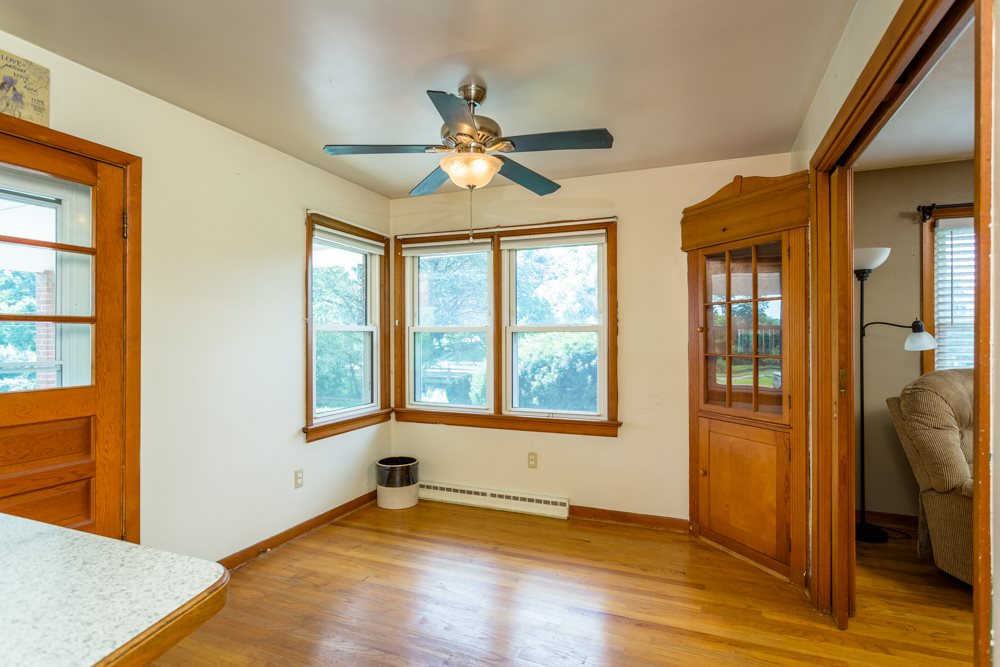 719 Middlebrook Road Staunton, VA 24401 - Photo 7 of 26 an empty room with wooden floor and windows