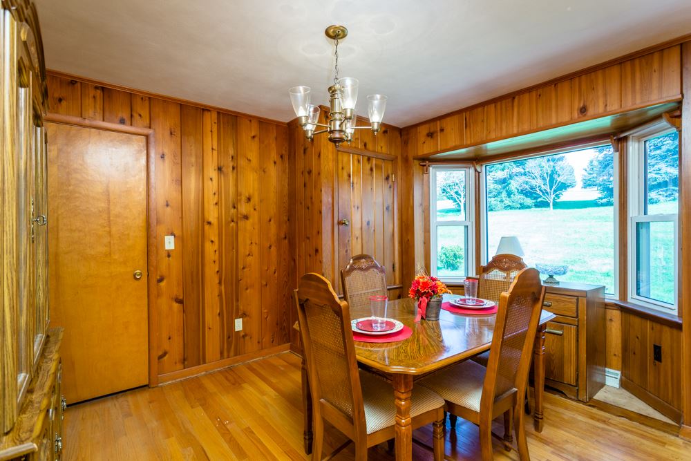 719 Middlebrook Road Staunton, VA 24401 - Photo 8 of 26 a dining room with furniture window wooden floor and garden view