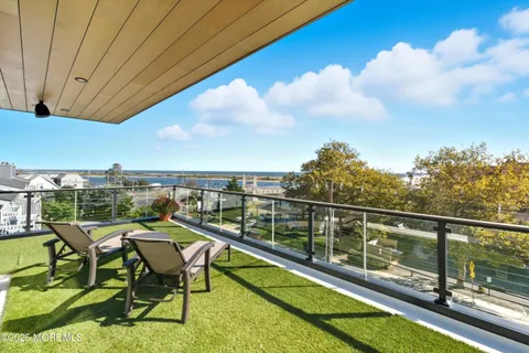 a view of a balcony with chairs