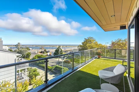 a view of a balcony with chairs