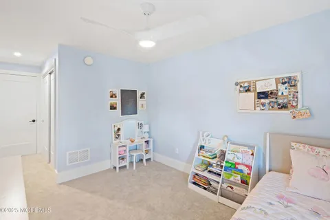 a bedroom with a bed and furniture