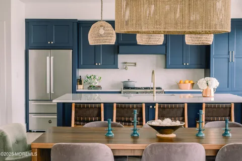 a kitchen with stainless steel appliances granite countertop a sink and a stove