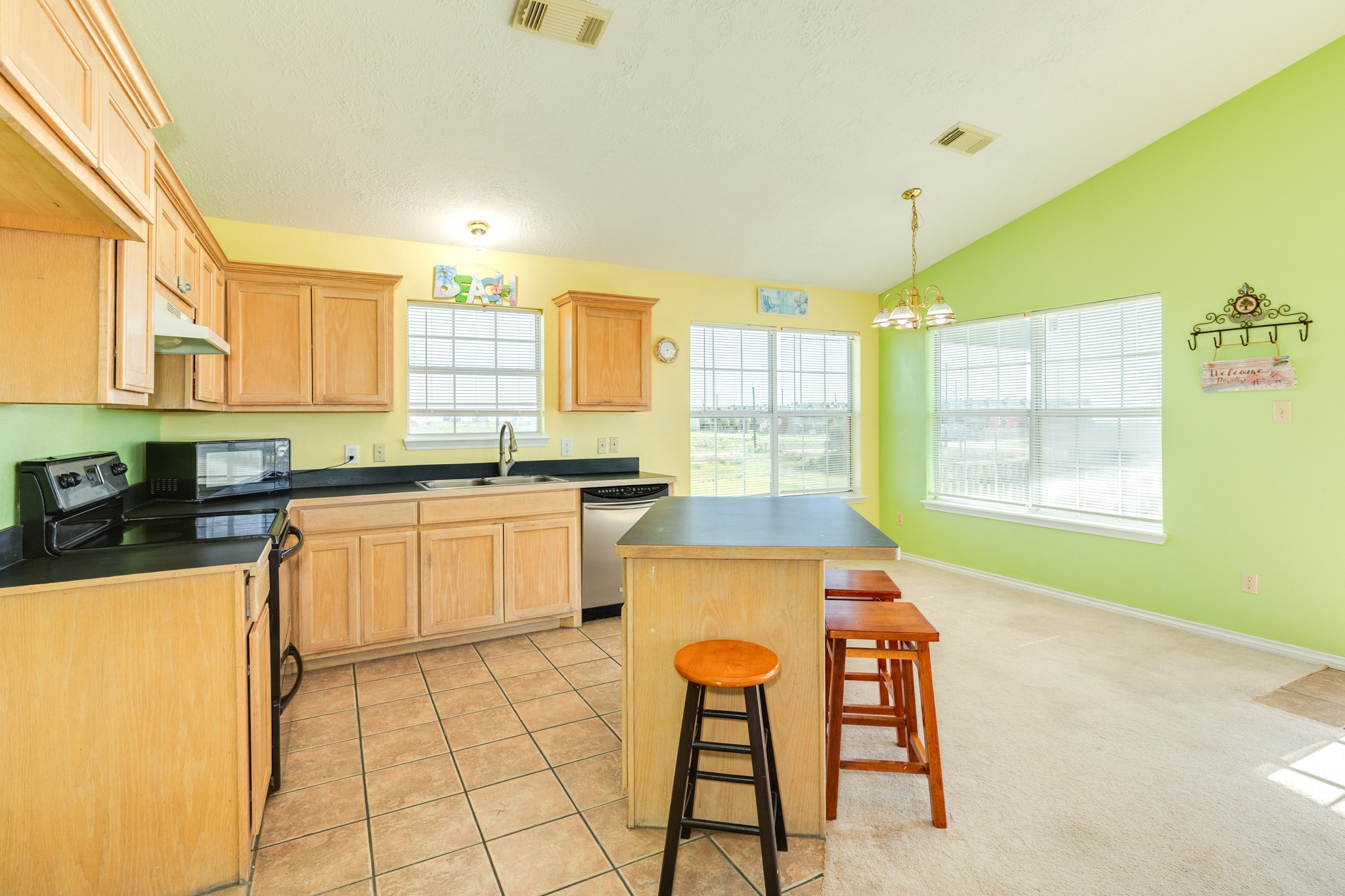 118 Lindrose Freeport, TX 77541 - Photo 15 of 26 a kitchen with a stove a sink dishwasher and a refrigerator