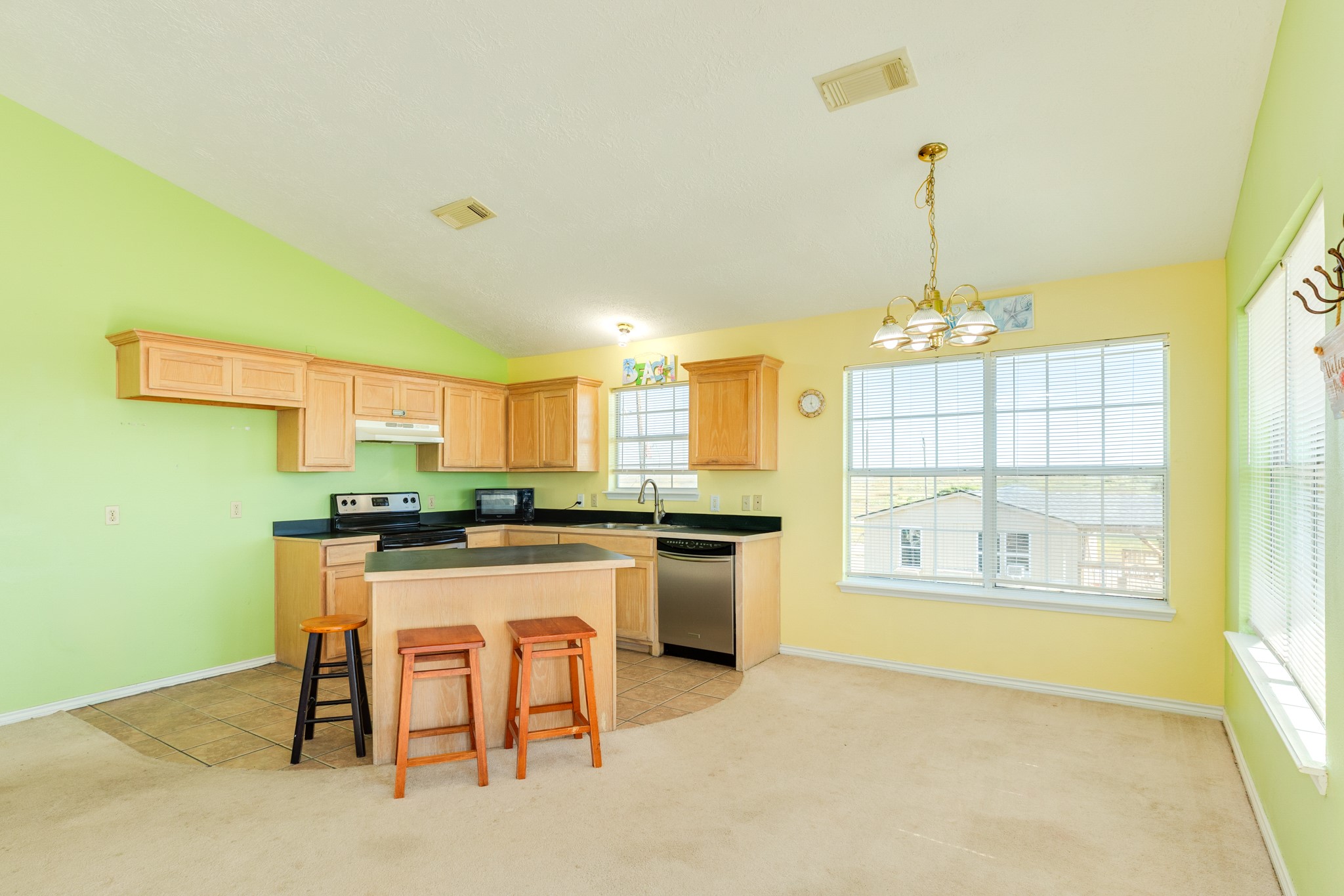 118 Lindrose Freeport, TX 77541 - Photo 5 of 26 a kitchen with stainless steel appliances granite countertop a stove a sink dishwasher and a refrigerator