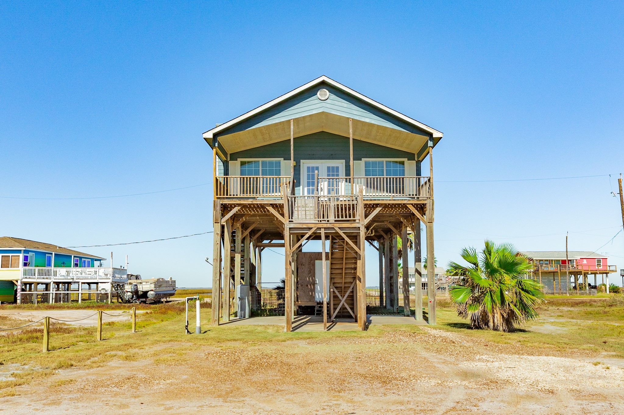 118 Lindrose Freeport, TX 77541 - Photo 6 of 26 a front view of a house with a yard