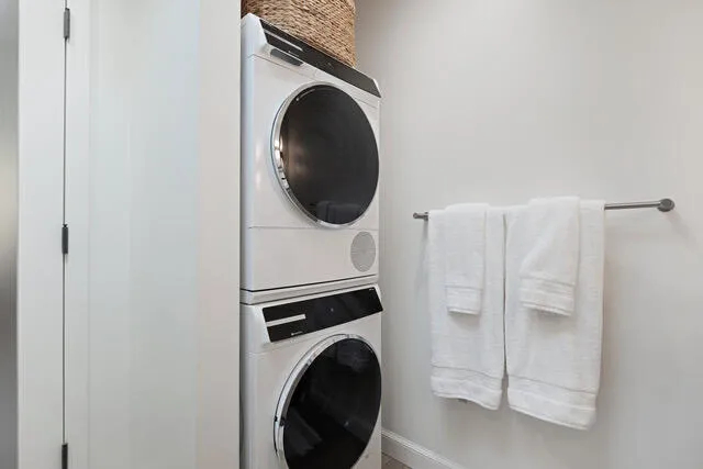 a close view of a utility room with dryer and washer