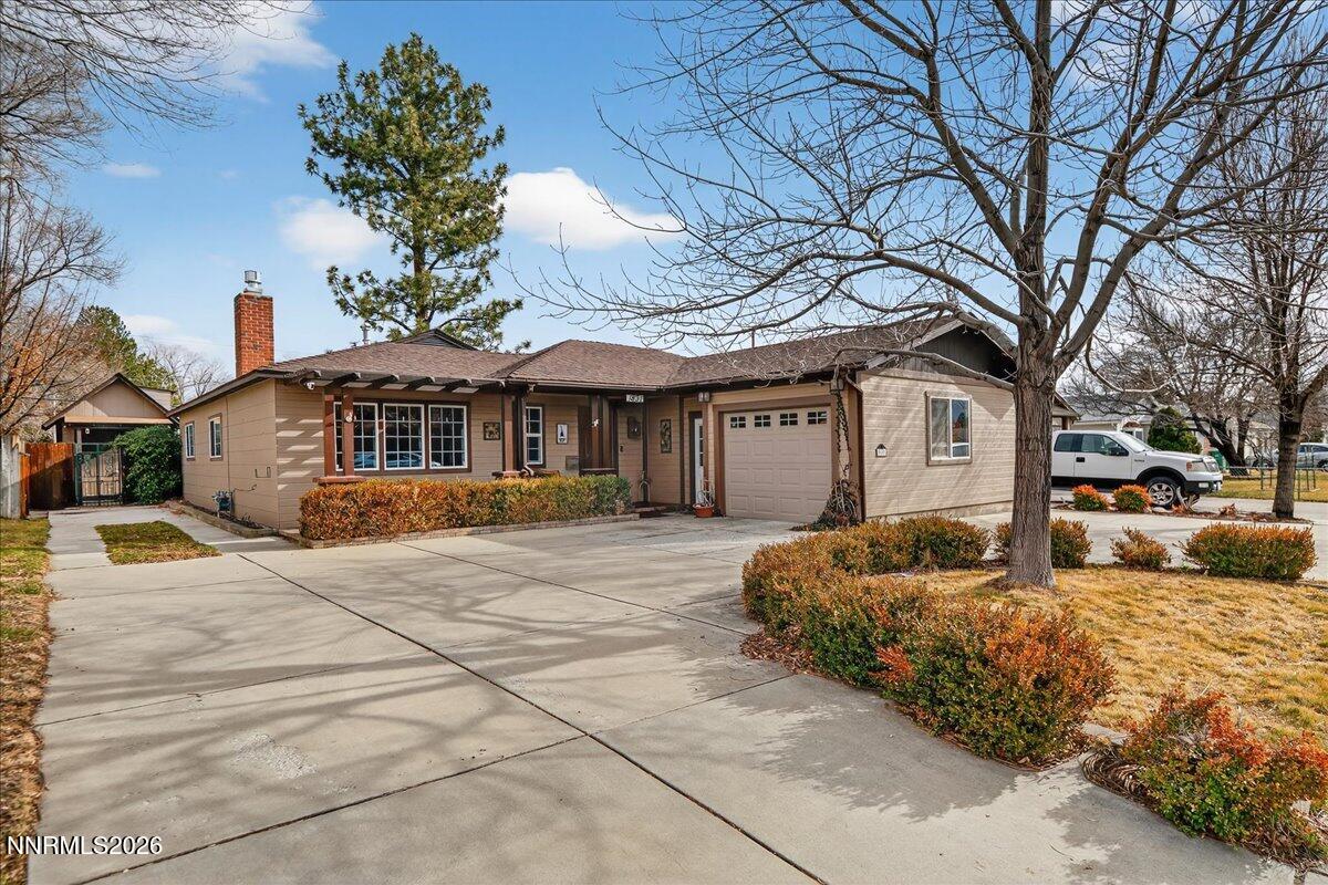 1831 North Division Street Carson City, NV 89703 - Photo 1 of 35 a front view of a house with a yard