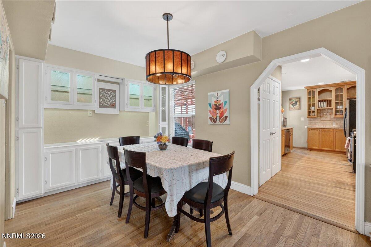 1831 North Division Street Carson City, NV 89703 - Photo 11 of 35 a view of a dining room with furniture wooden floor and chandelier