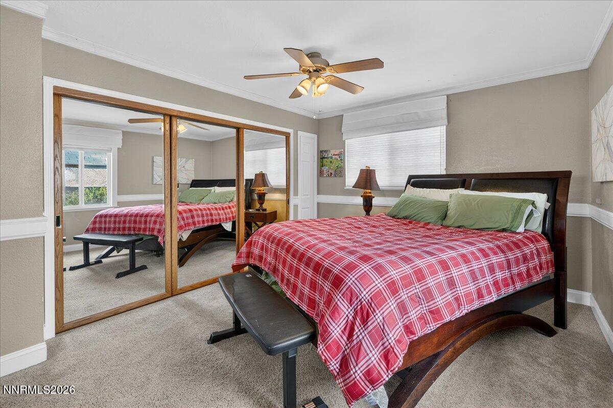 1831 North Division Street Carson City, NV 89703 - Photo 18 of 35 a bedroom with a bed and a window