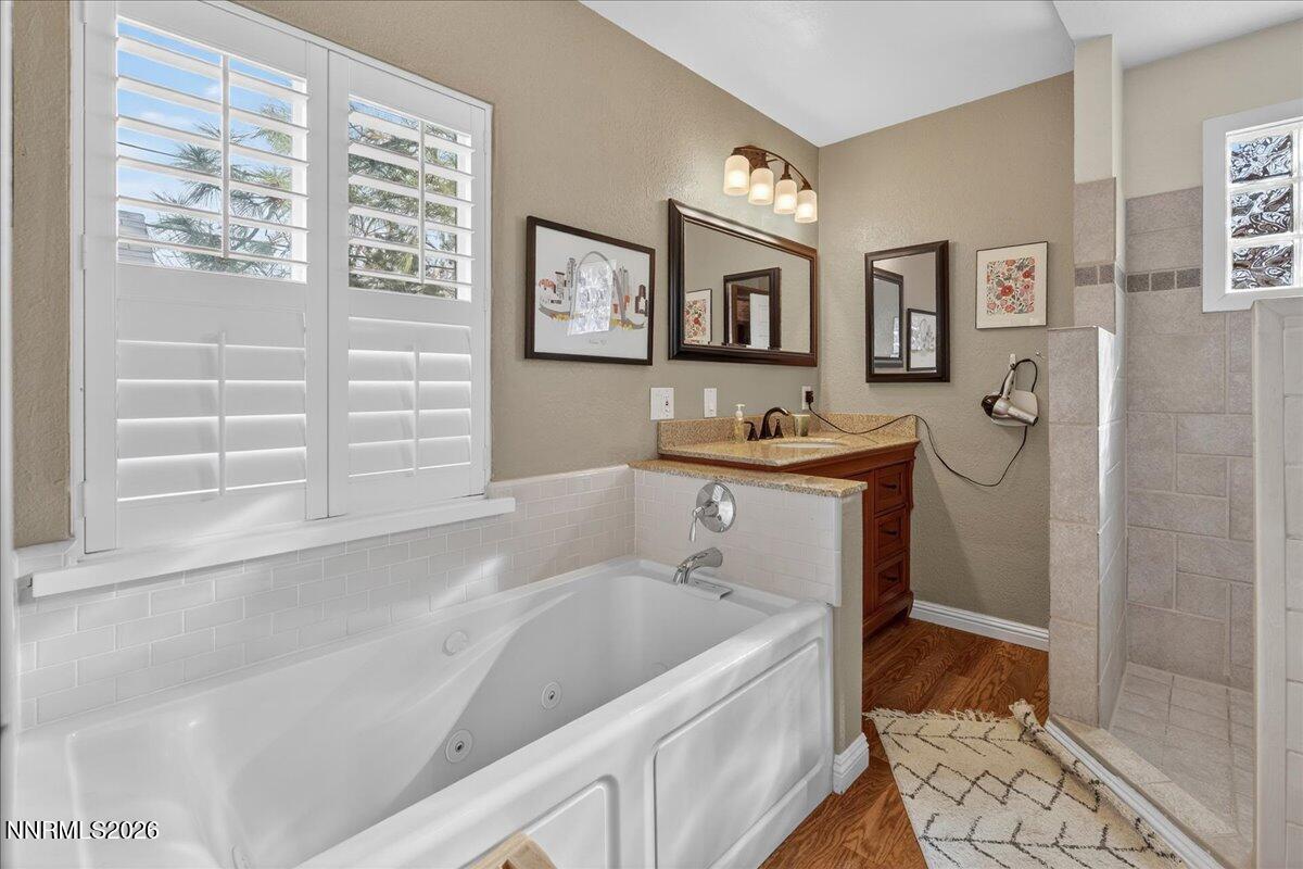 1831 North Division Street Carson City, NV 89703 - Photo 20 of 35 a bathroom with a tub sink and mirror