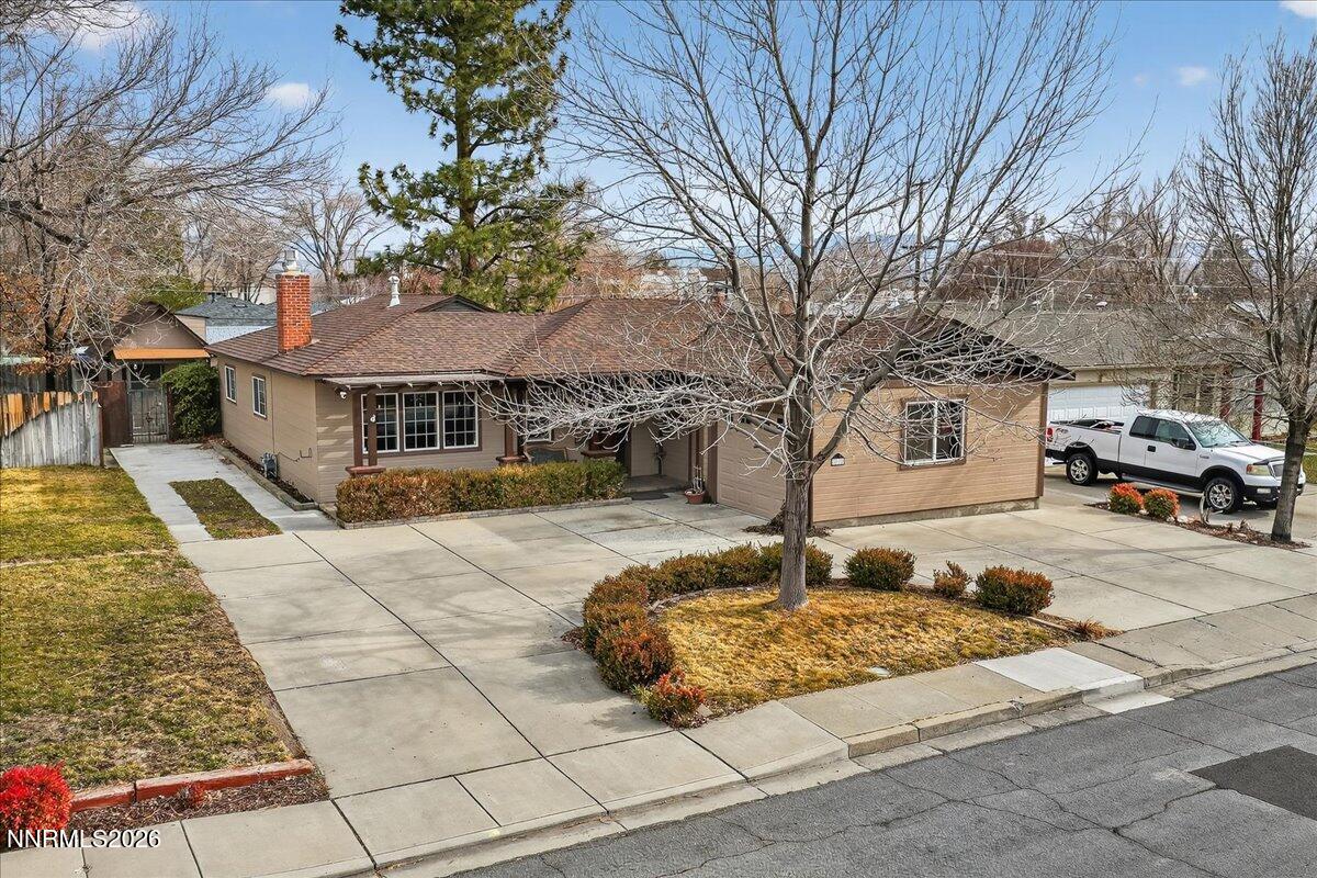 1831 North Division Street Carson City, NV 89703 - Photo 2 of 35 a front view of a house with garden