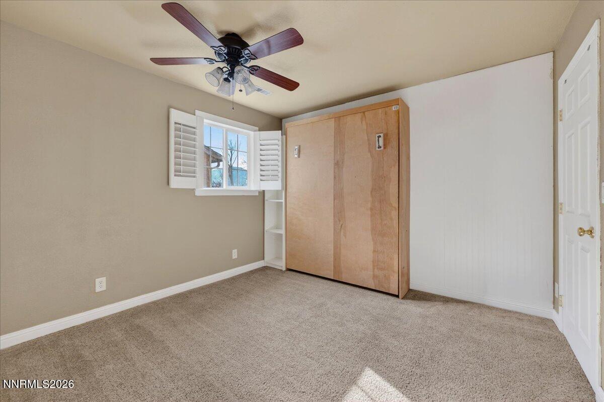 1831 North Division Street Carson City, NV 89703 - Photo 23 of 35 a view of an empty room with a ceiling fan