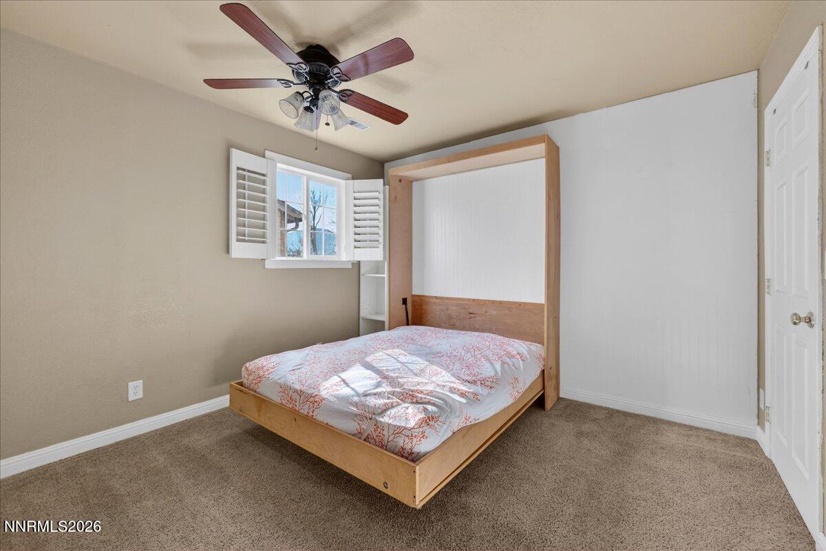 1831 North Division Street Carson City, NV 89703 - Photo 24 of 35 a bedroom with a bed and window
