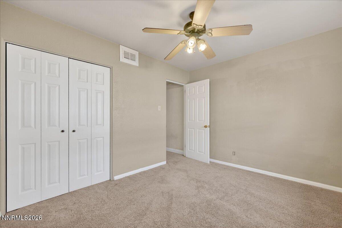 1831 North Division Street Carson City, NV 89703 - Photo 25 of 35 a view of an empty room with a chandelier fan