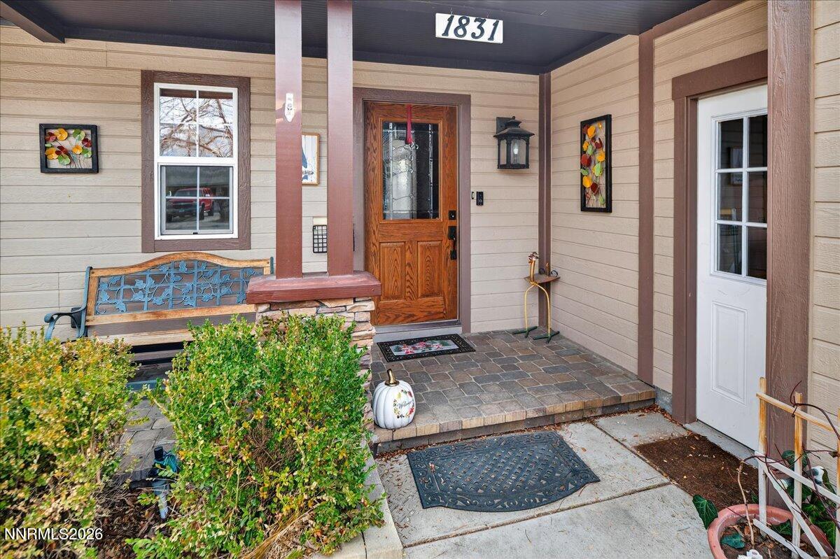 1831 North Division Street Carson City, NV 89703 - Photo 4 of 35 front view of a house with a door and a rug