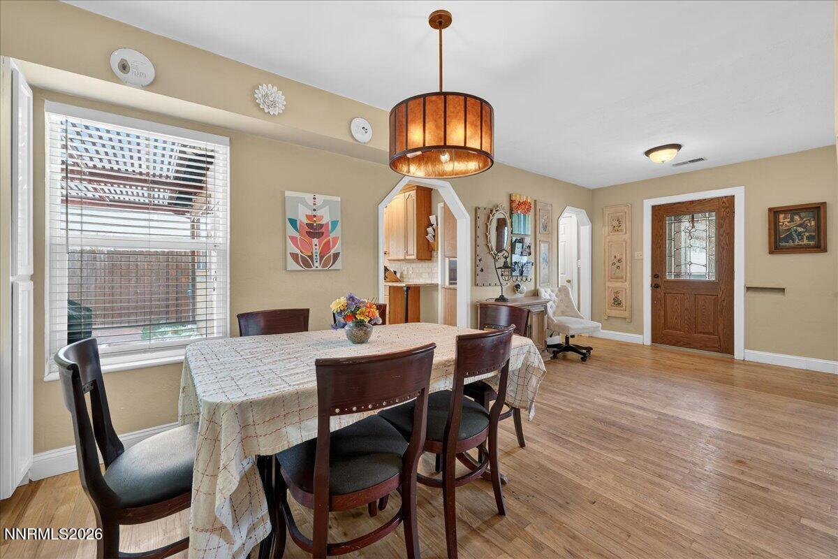 1831 North Division Street Carson City, NV 89703 - Photo 10 of 35 a view of a dining room with furniture window and wooden floor