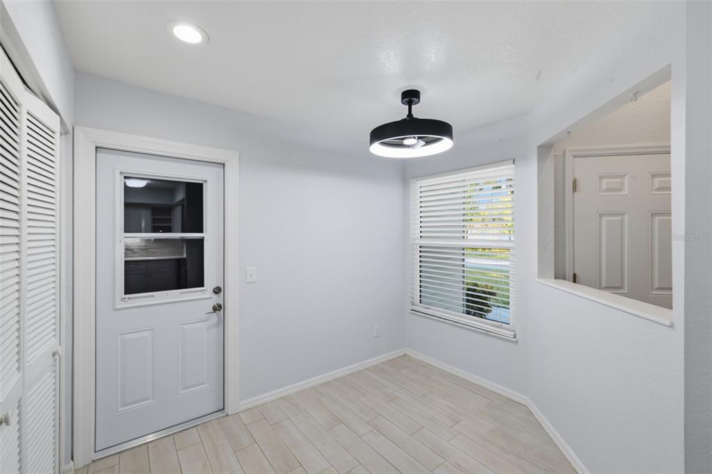 21425 Clubside Loop Lutz, FL 33549 - Photo 11 of 42 wooden floor in an empty room with a window