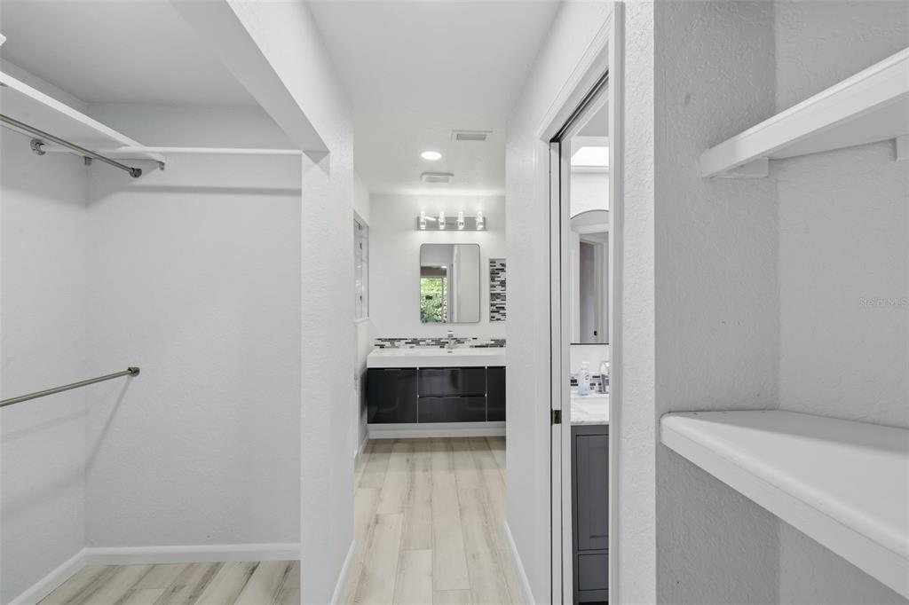 21425 Clubside Loop Lutz, FL 33549 - Photo 15 of 42 a bathroom with a tub sink and mirror