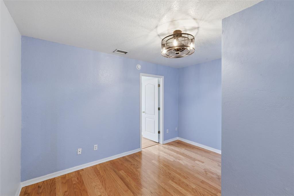 21425 Clubside Loop Lutz, FL 33549 - Photo 19 of 42 a view of a hallway with a chandelier