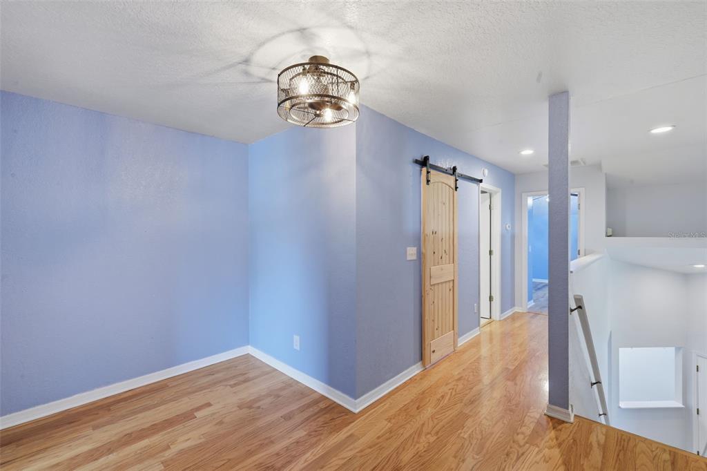 21425 Clubside Loop Lutz, FL 33549 - Photo 20 of 42 a view of hallway with wooden floor