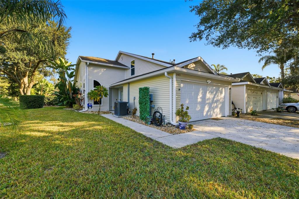 21425 Clubside Loop Lutz, FL 33549 - Photo 2 of 42 a view of a house with backyard and porch