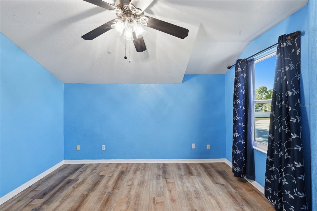 21425 Clubside Loop Lutz, FL 33549 - Photo 24 of 42 wooden floor in an empty room with a window