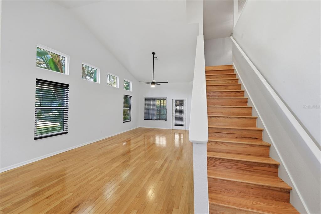 21425 Clubside Loop Lutz, FL 33549 - Photo 4 of 42 a view of an entryway with wooden floor and a front door