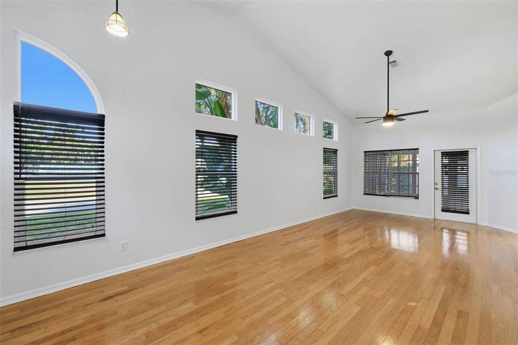 21425 Clubside Loop Lutz, FL 33549 - Photo 5 of 42 a view of an empty room with wooden floor and a window
