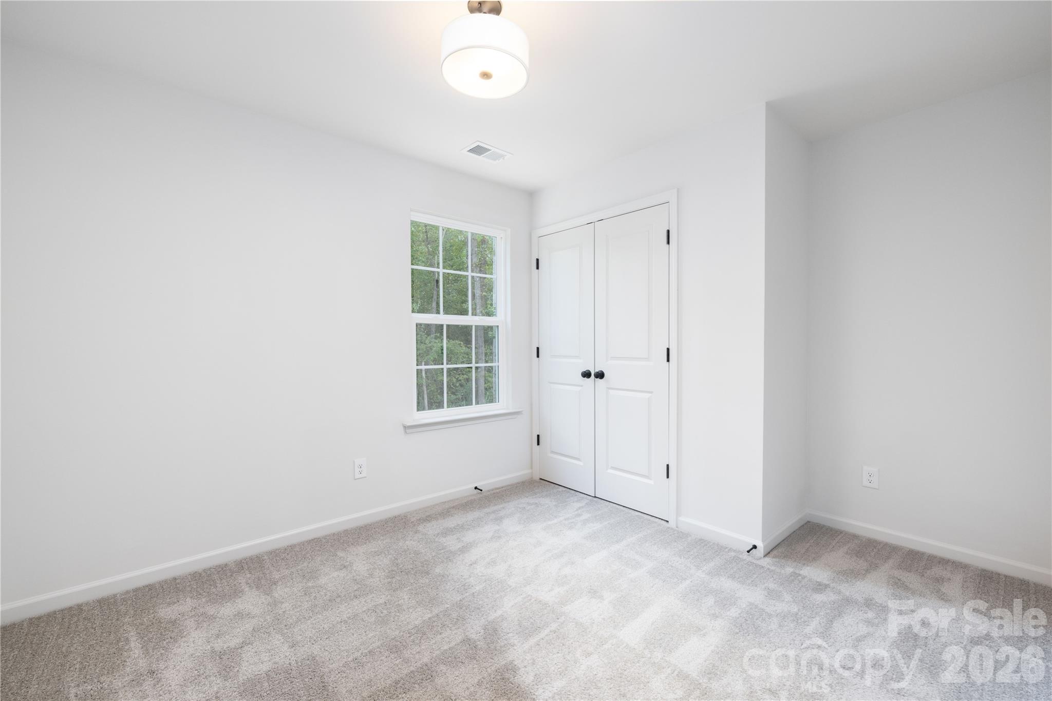 1422 Summerville Road Charlotte, NC 28214 - Photo 16 of 24 an empty room with windows