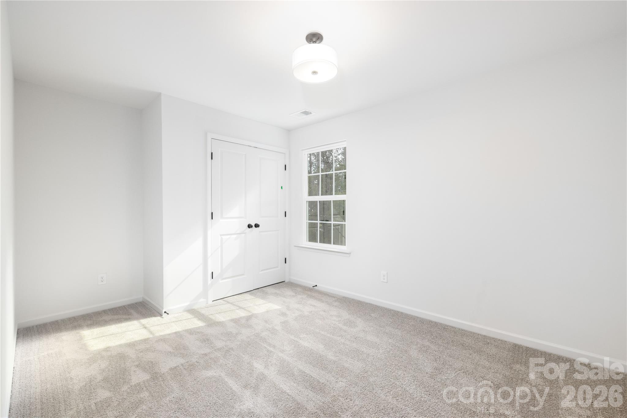 1422 Summerville Road Charlotte, NC 28214 - Photo 17 of 24 an empty room with windows