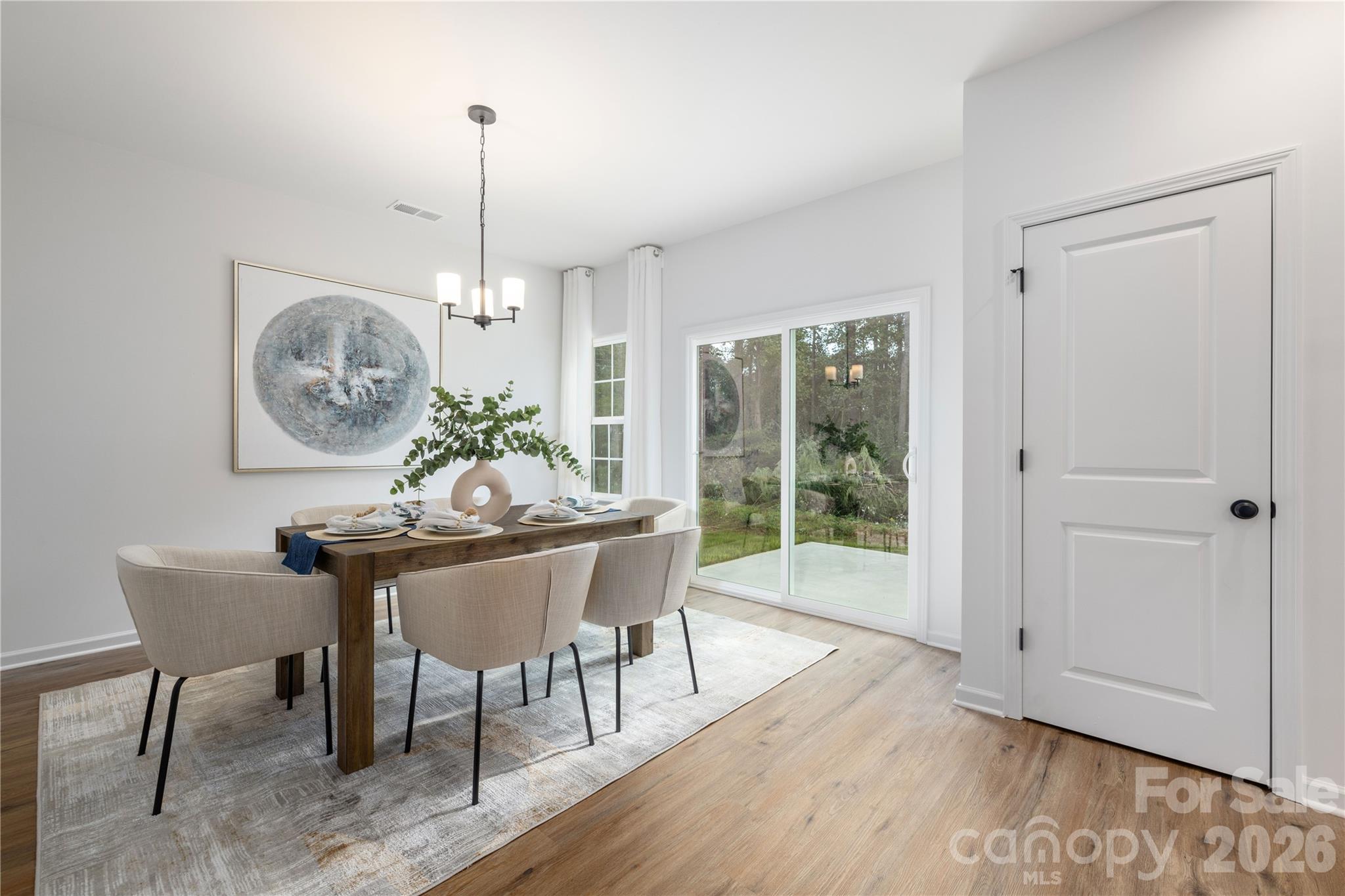 1422 Summerville Road Charlotte, NC 28214 - Photo 9 of 24 a view of a dining room with furniture window and wooden floor