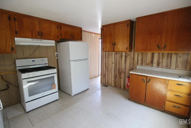 a kitchen with appliances and cabinets