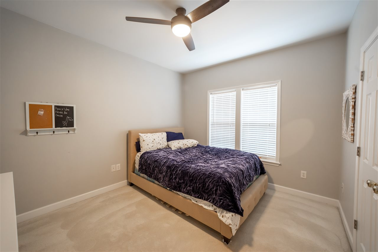 4425 Gallatree Lane Raleigh, NC 27616 - Photo 21 of 24 Large bedroom. Fresh paint and updated light fixture/fan. Bedroom