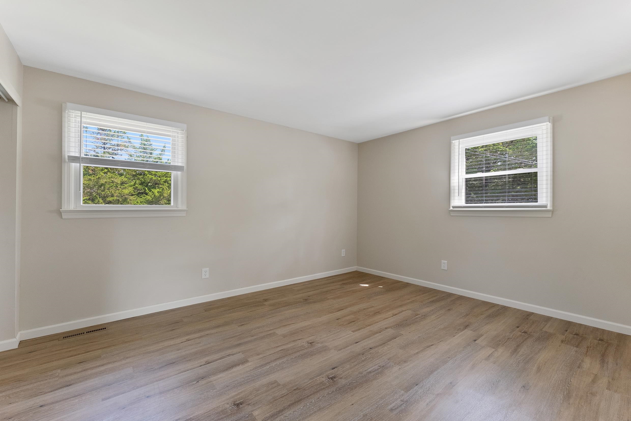 119 Butter Ocean View, NJ 08230 - Photo 11 of 29 a view of an empty room with wooden floor and a window