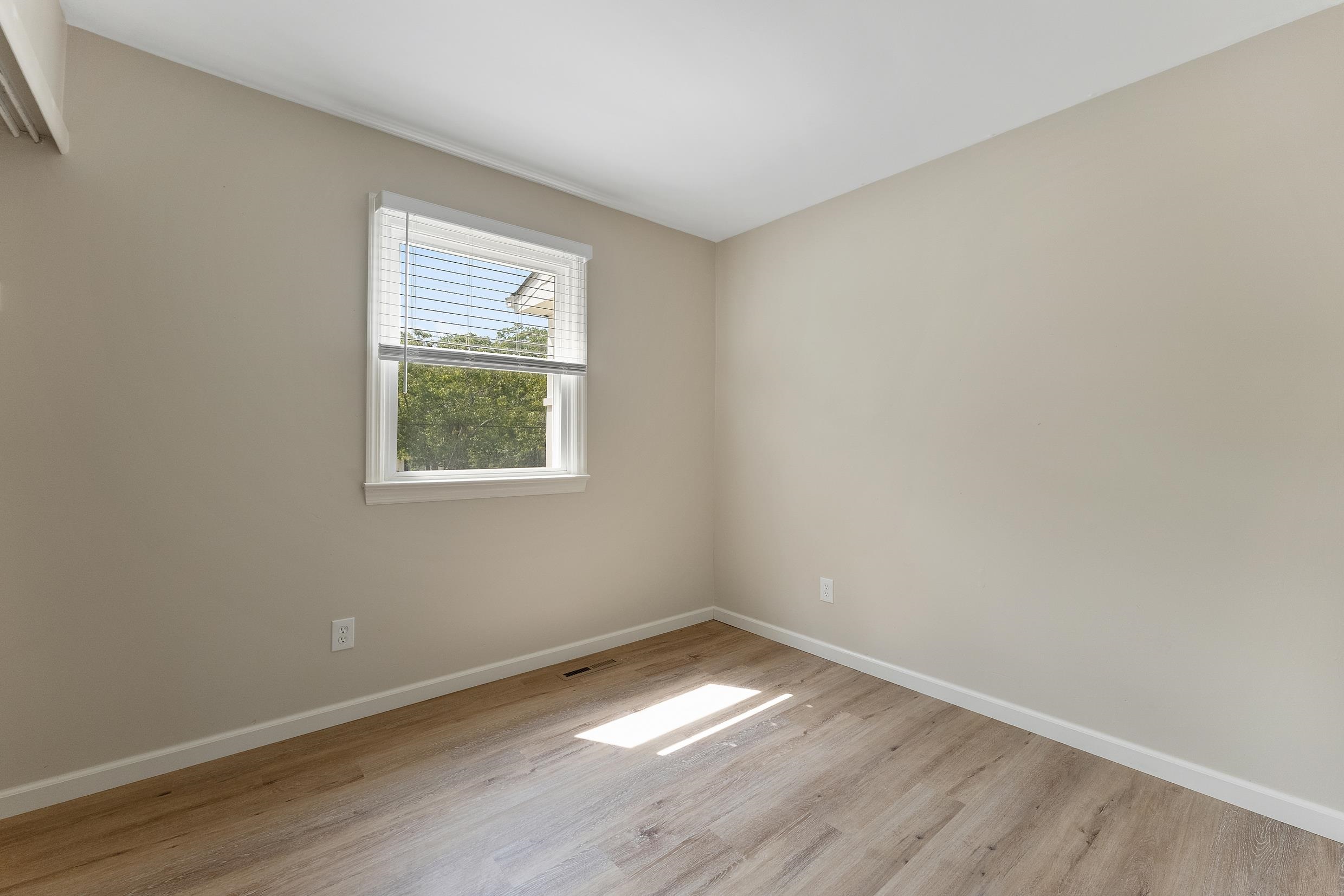 119 Butter Ocean View, NJ 08230 - Photo 14 of 29 wooden floor in an empty room with a window