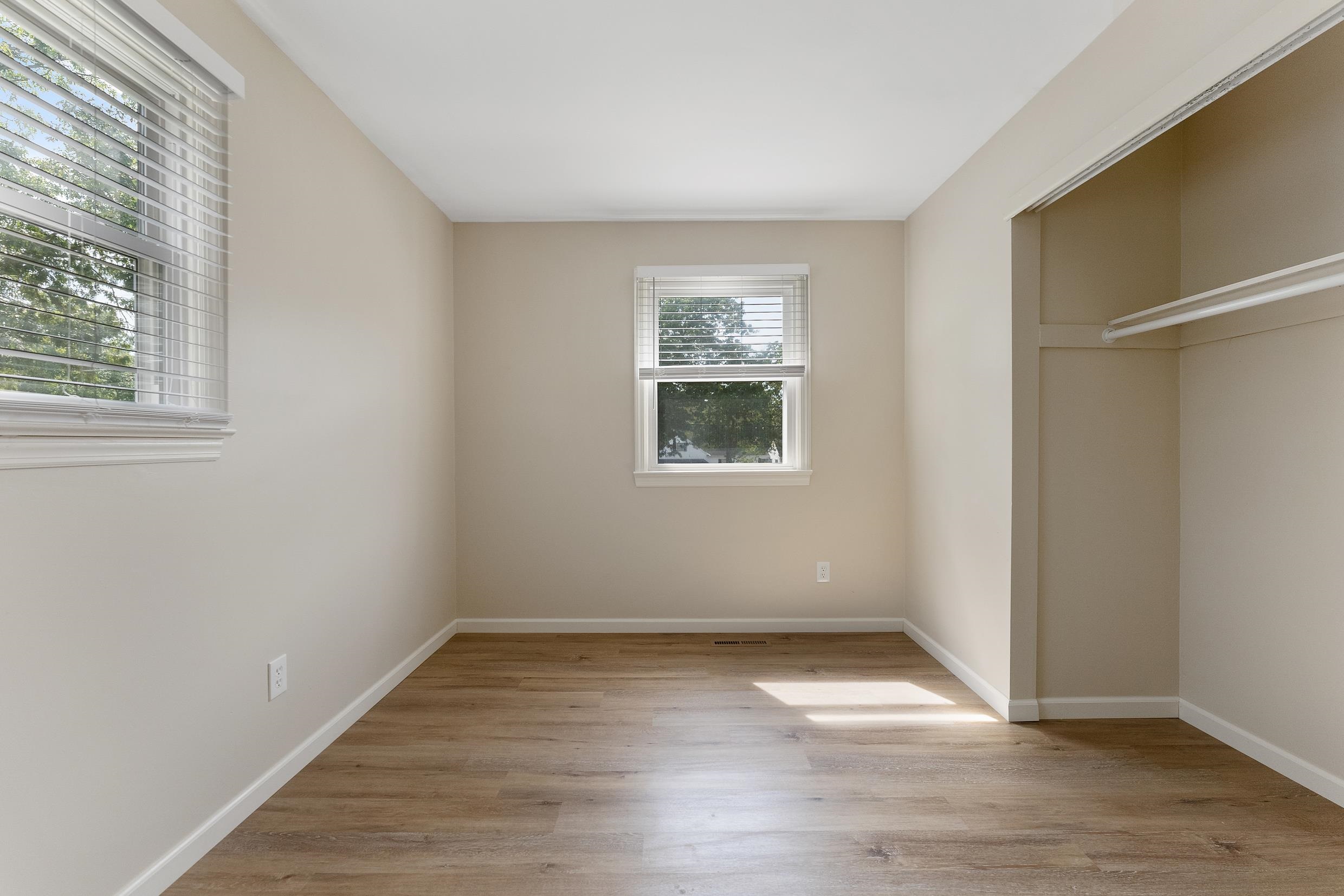 119 Butter Ocean View, NJ 08230 - Photo 16 of 29 an empty room with wooden floor and windows