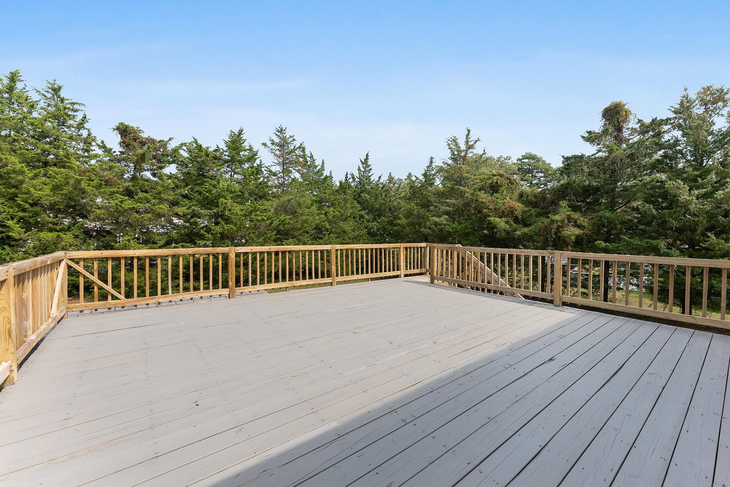 119 Butter Ocean View, NJ 08230 - Photo 25 of 29 a balcony with wooden floor and city view