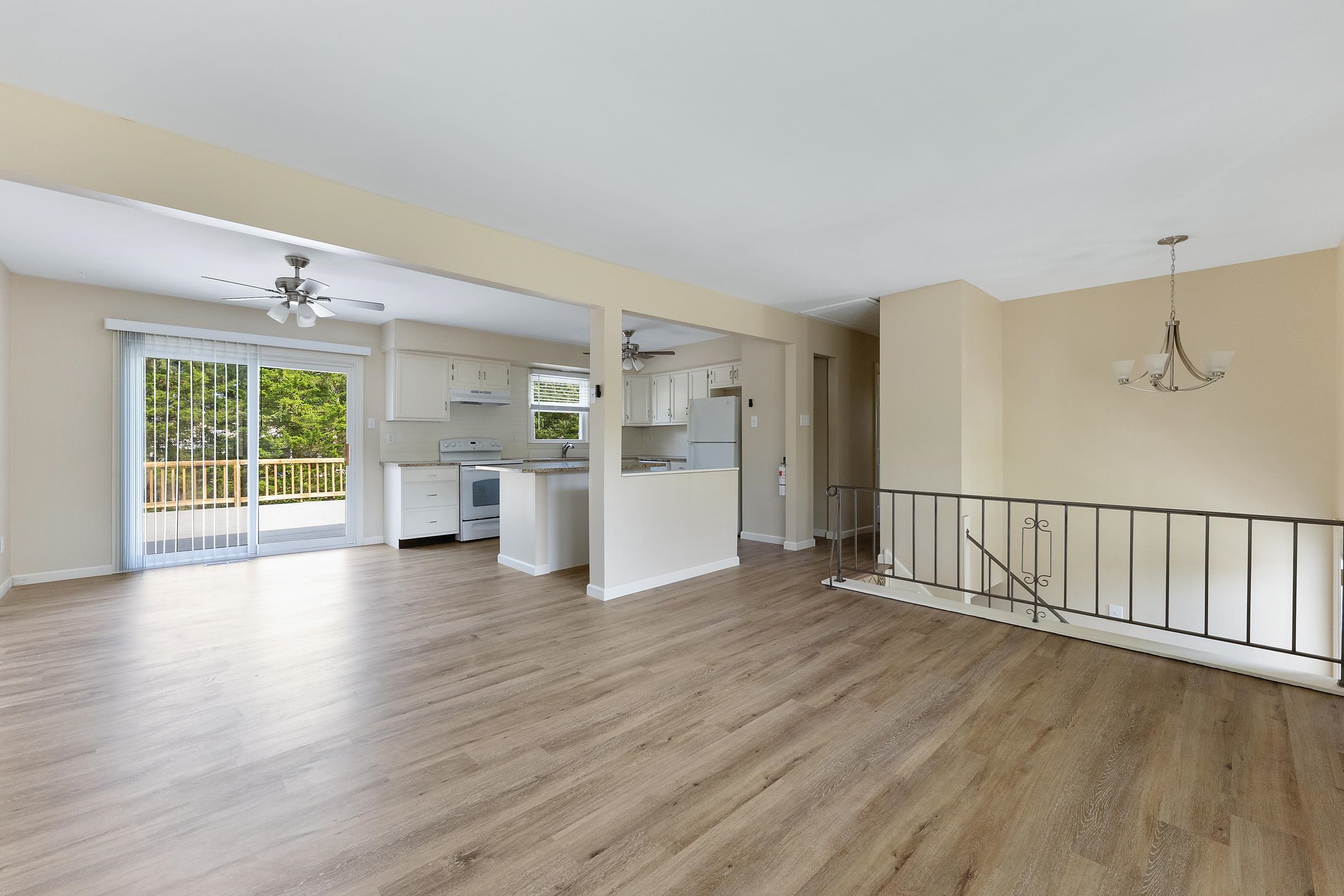 119 Butter Ocean View, NJ 08230 - Photo 6 of 29 a view of a kitchen with wooden floor and a window