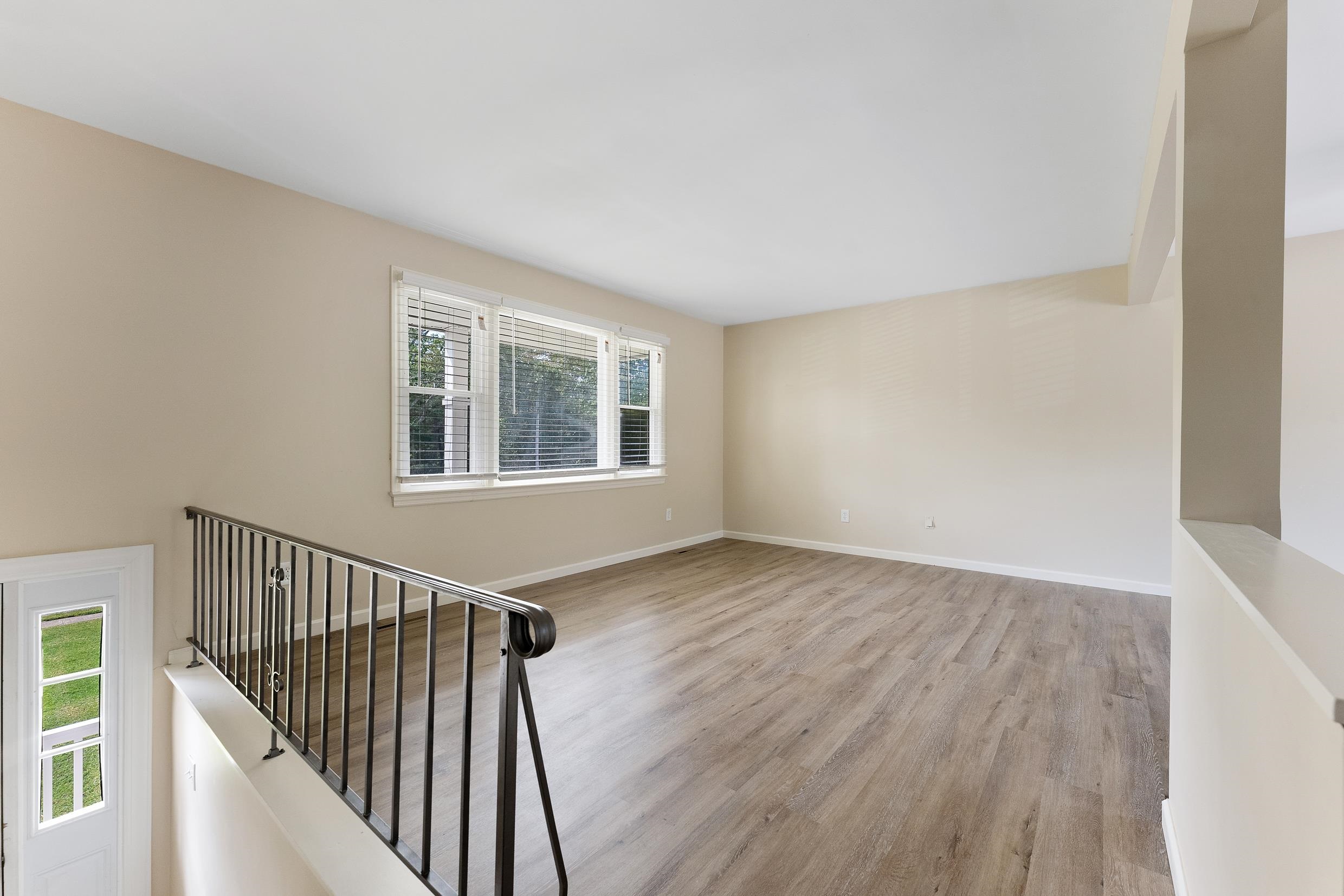 119 Butter Ocean View, NJ 08230 - Photo 7 of 29 a view of an empty room with wooden floor and a window