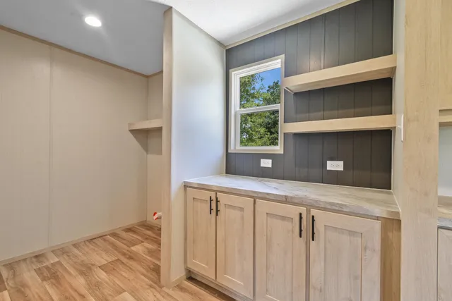 a kitchen with a sink and a window