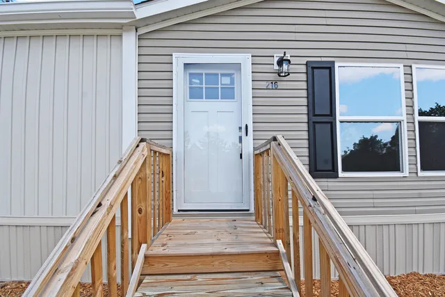a view of a balcony with wooden floor and stairs