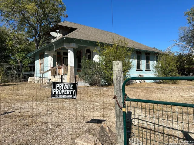 a view of a building with a iron gate