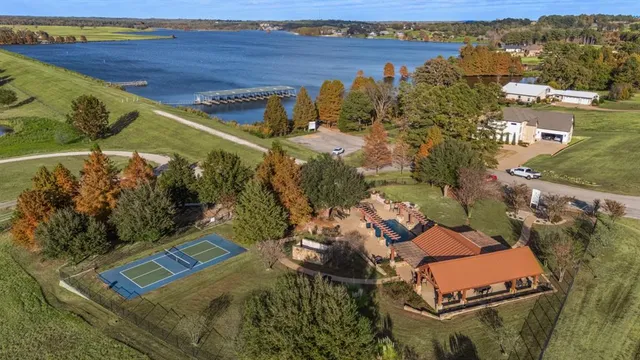 an aerial view of a house with a lake view
