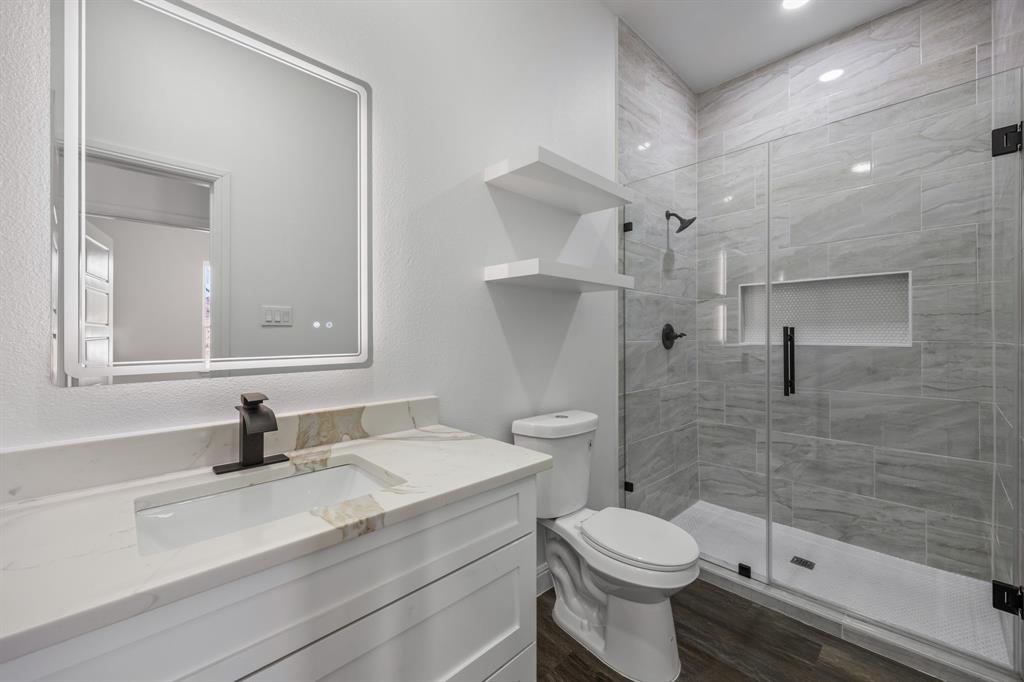 4651 Grand View Drive Athens, TX 75752 - Photo 15 of 23 a bathroom with a sink a toilet and a shower