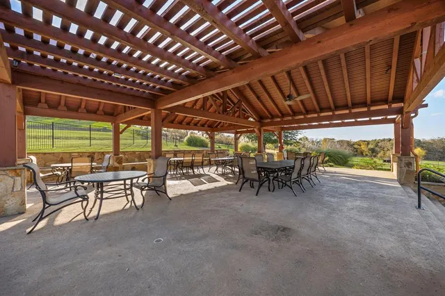 a view of a porch with furniture and a backyard