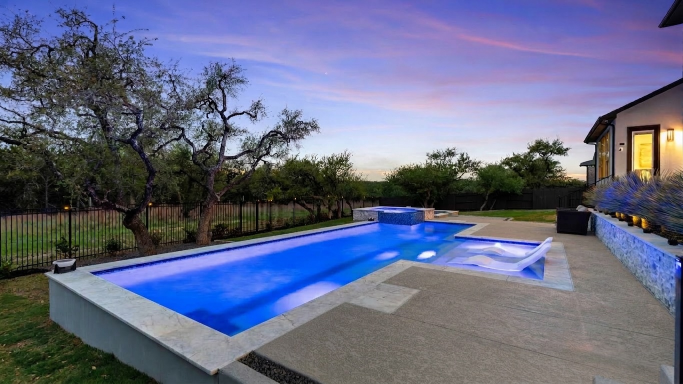 a view of swimming pool with lounge chair and dinning table under an umbrella
