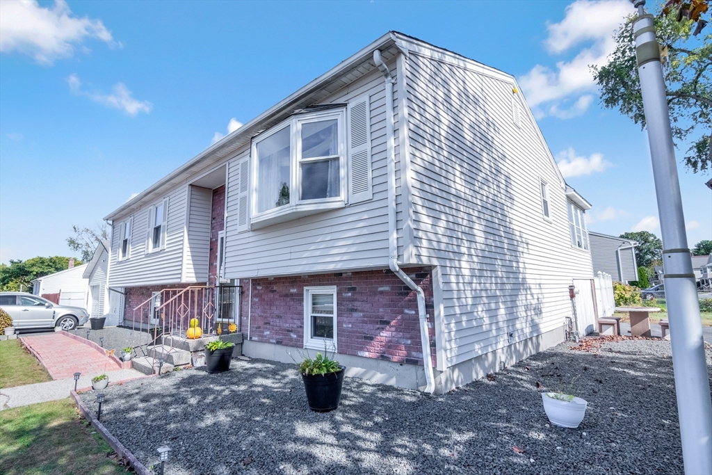 485 Riverside Road Springfield, MA 01107 - Photo 1 of 33 a view of a house with a patio
