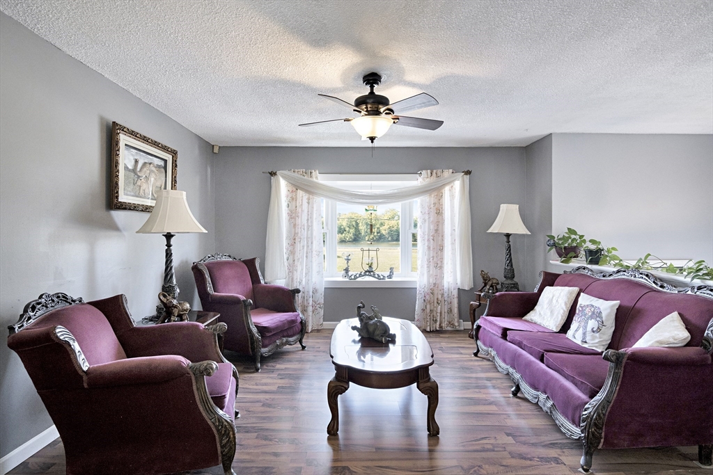 485 Riverside Road Springfield, MA 01107 - Photo 11 of 33 a living room with furniture and a large window