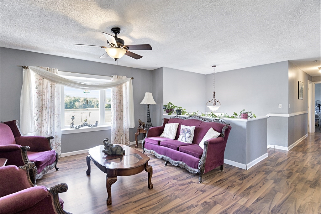 485 Riverside Road Springfield, MA 01107 - Photo 12 of 33 a living room with furniture and a large window